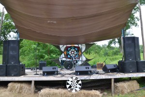 The stage with lots of equipment that had to be staged by many helping hands including background art
